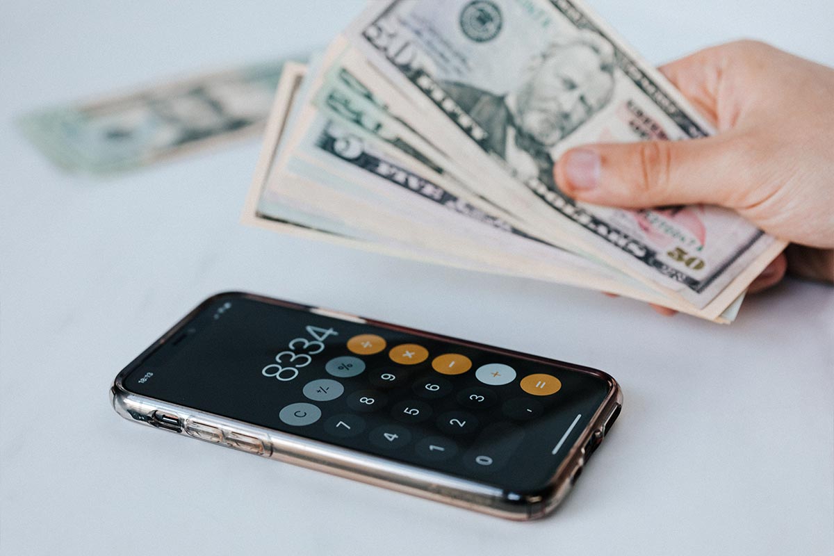 A phone showing a high-yield savings account balance growing — how to build an emergency fund automatically