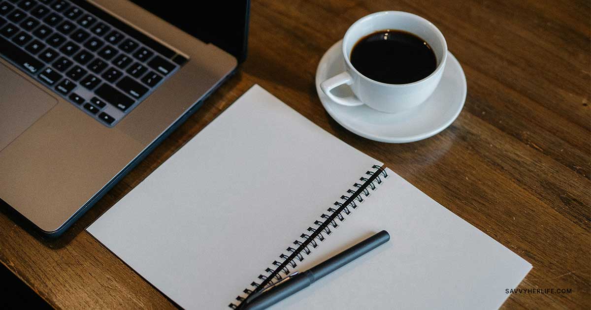 Frugal living tips for beginners — Notes app open showing a price book and saved-money log on a kitchen table