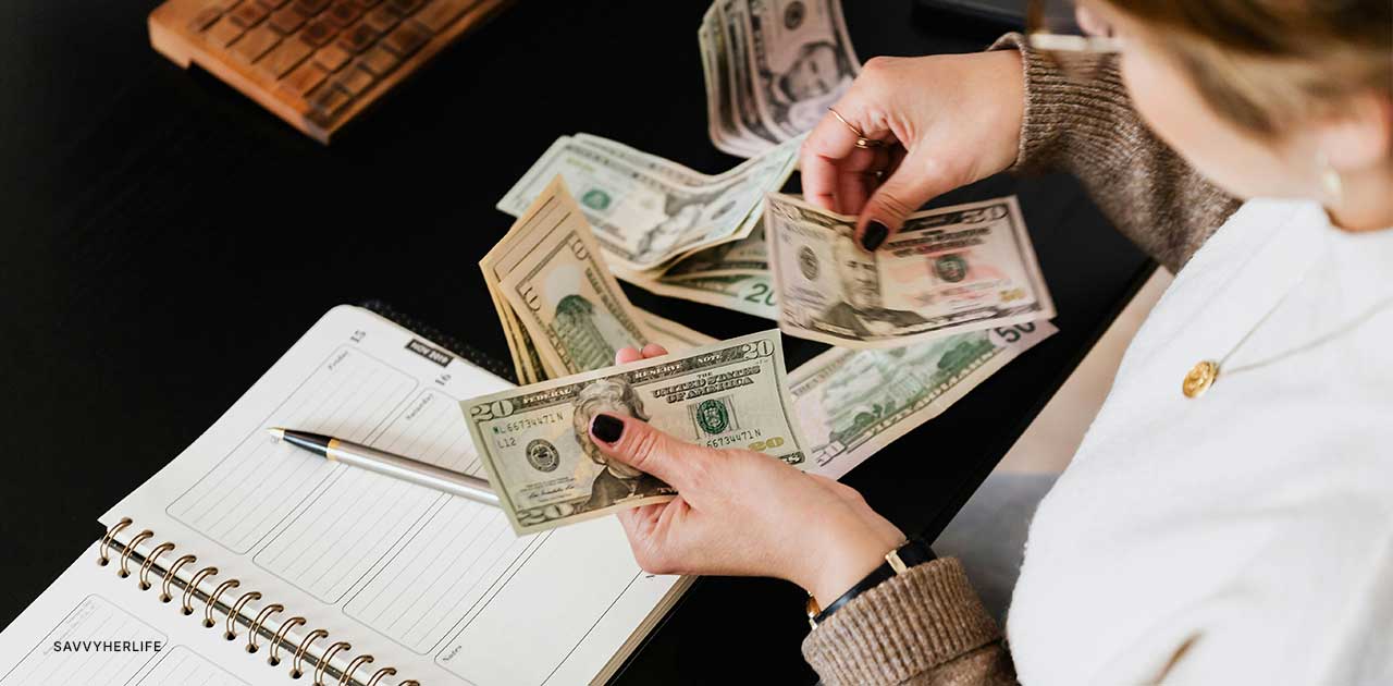 30-day no spend challenge with cash and budget planner on desk — tracking real money saved during a no-spend month