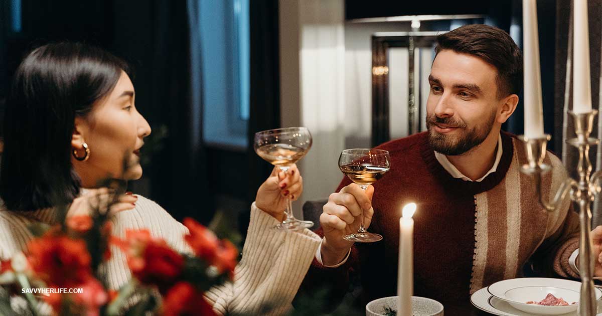 Cheap date ideas at home — a cozy at-home date night with candles, wine, a board game, and a blanket on the couch