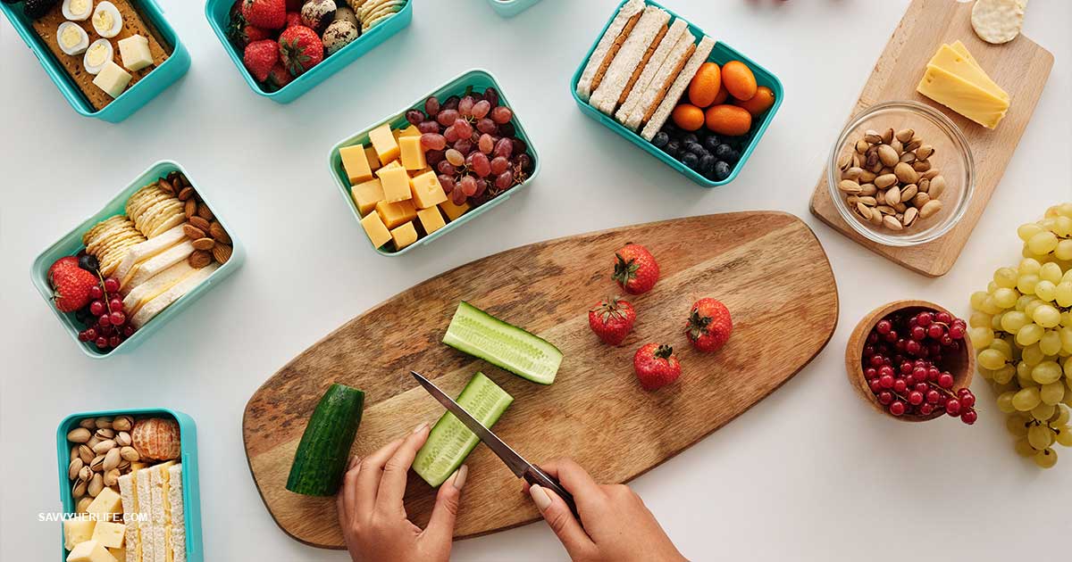 Meal planning on a tight budget — a weekly meal plan written in a notebook next to fresh groceries and a shopping list