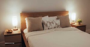 Night routine on a budget — a warm lamp, a cup of herbal tea, and a book on a nightstand.